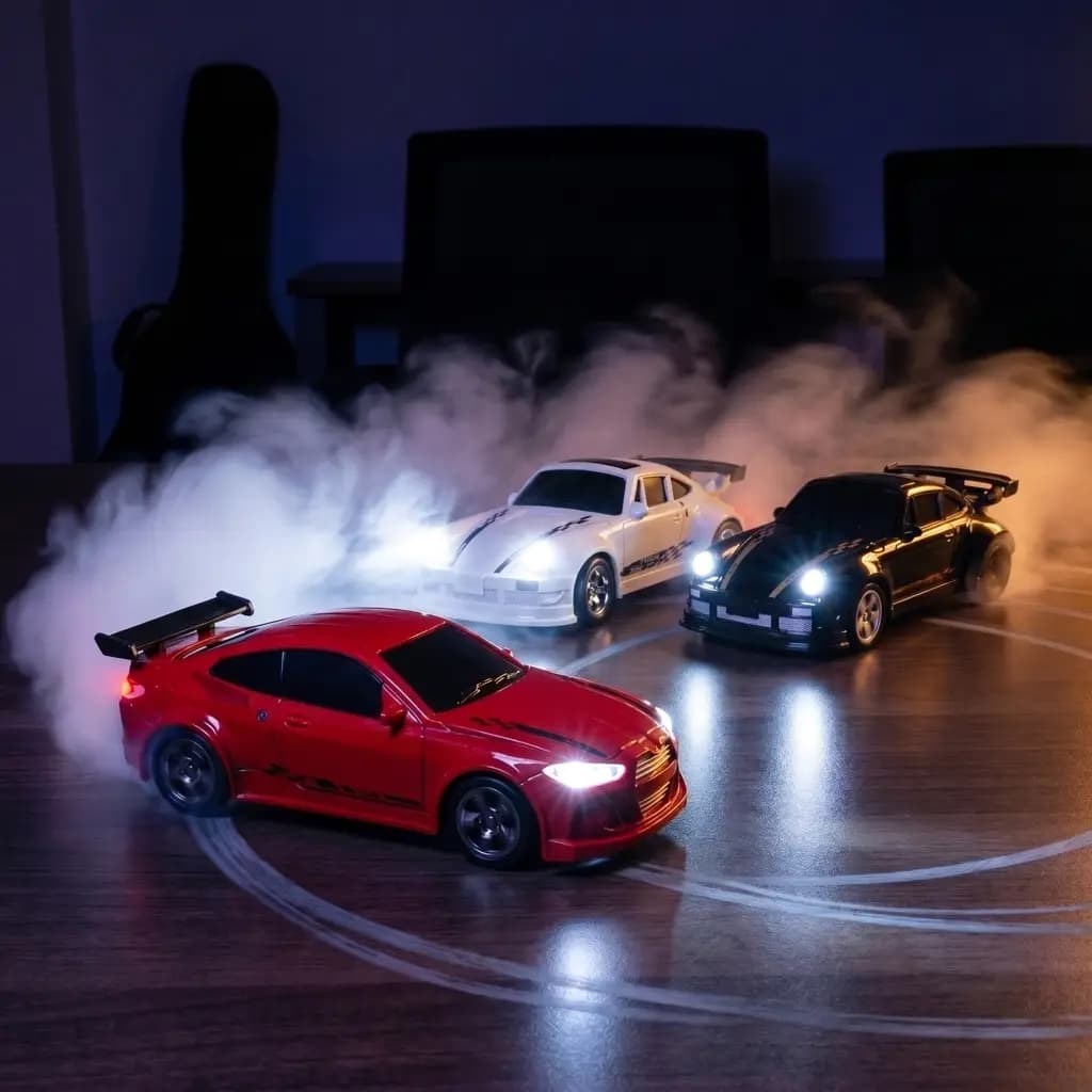 Three DeskDrift Pro RC drift cars drifting at night on a desk, headlights blazing through tyre smoke